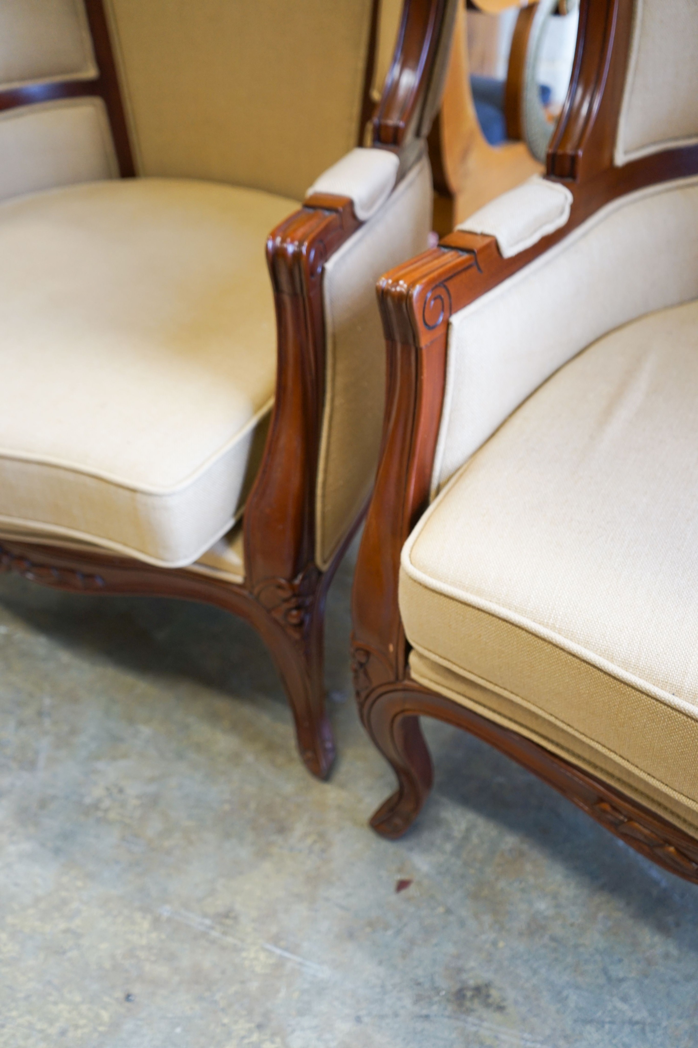 A pair of Victorian style upholstered carved mahogany hall porter's chairs, width 80cm, depth 66cm, height 162cm